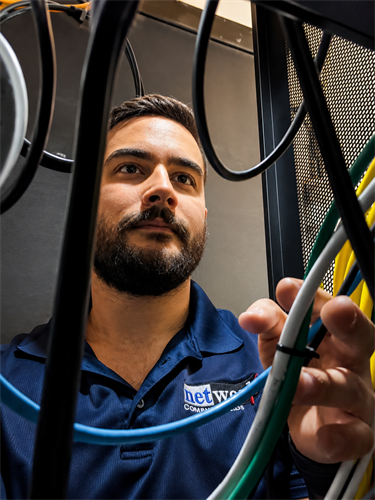 Network Computer Pros Technician working in Server Rack