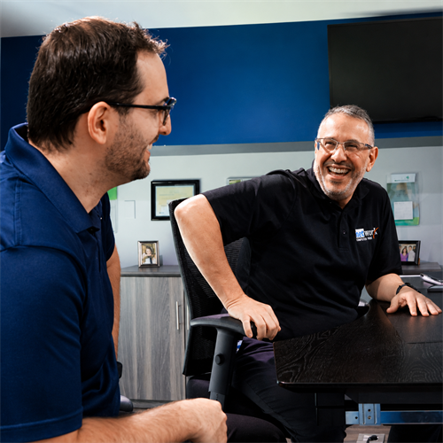 Network Computer Pros having a meeting in a conference room