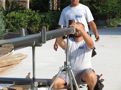 Zeb, COO working on 6in Dark Bronze Half Round Gutter