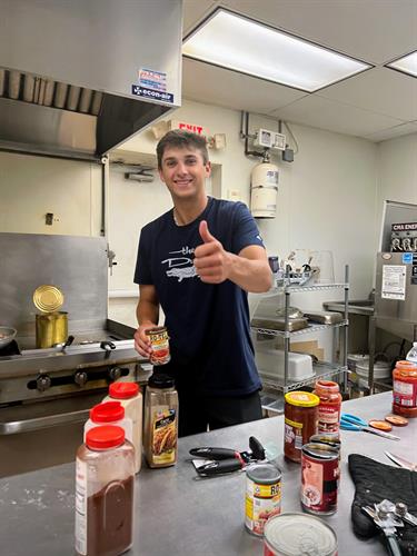 Clemson student, Jack Bamrick, cooking at Shpherd's Table