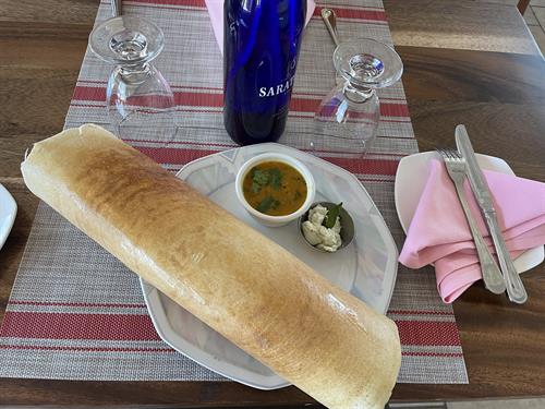 Masala dosa . A dosa is a thin, savoury crepe in South Indian cuisine made from a fermented batter of ground white gram and rice. Dosas are served hot, often with chutney and sambar (a lentil-based vegetable stew). 