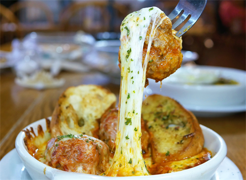 Gallery Image Meatball_cheese_pull___HnK_Meatballs__Three_of_our_made_from_scratch._all_natural_Angus_meatballs._served_with_mozzarella._marinara_and_garlic_bread.png