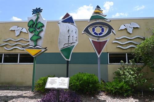 Aluminum statues outside Palm Harbor LIbrary