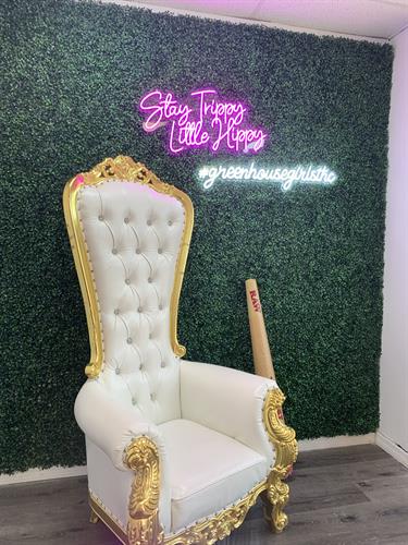 Snap a pic and share it with the world! Our photo chair is ready for you. Capture the essence of Greenhouse Girls merchandise and spread the word.