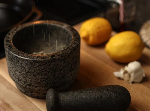 Food photography highlighting traditional culinary tools through strategic composition and natural lighting techniques. Food photography highlighting traditional culinary tools through strategic composition and natural lighting techniques.