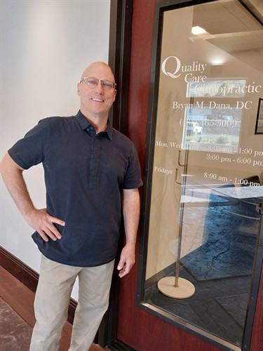 Dr. Dana at the office front door