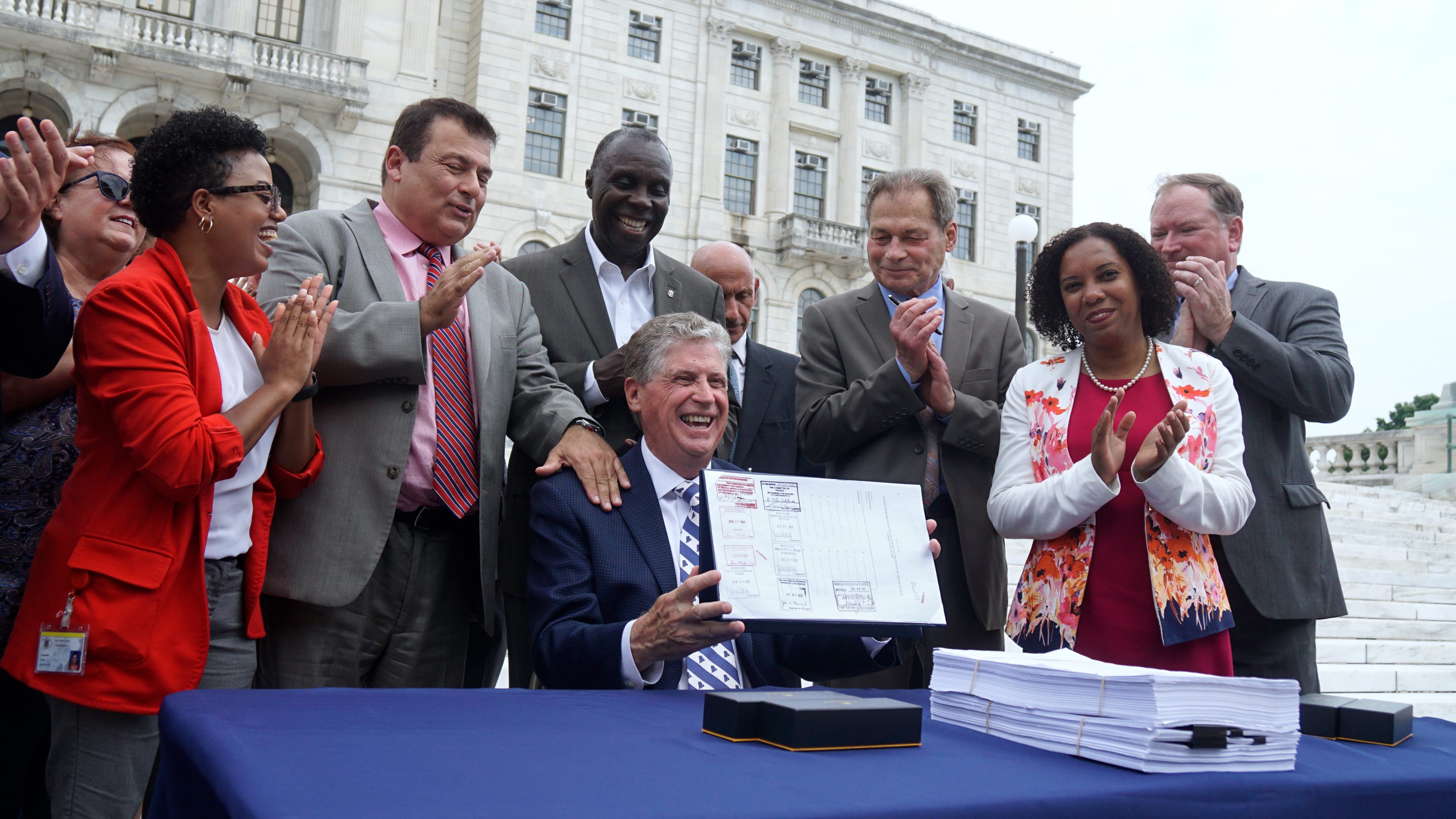 McKee signs $13B budget; could still extend state of emergency