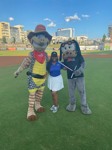 Our store marketer Kari and mascot Andy the Armadillo hanging out with their bestie Babe at the Barons game. 