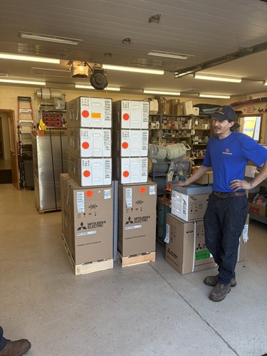 All Mechanical Service technician Skylar B. with Mitsubishi Electric ductless heating and cooling systems ready for installation.