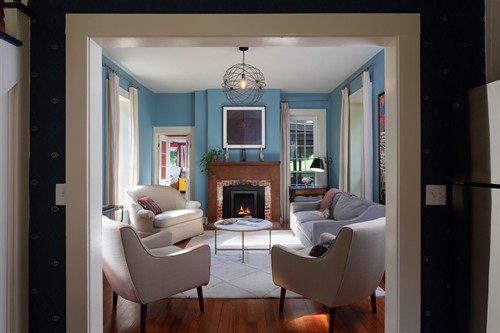 The cozy living room with lots of original art.