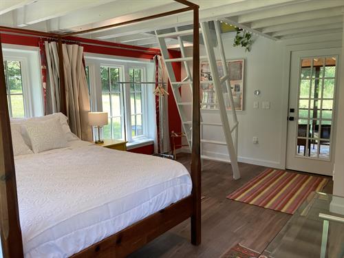 Summer kitchen bedroom and ladder to loft