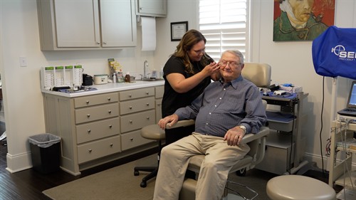 Dr. Hollie Green inspects a patient's ear during a routine appointment.