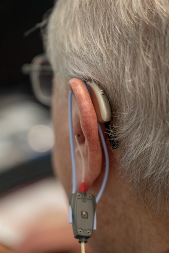 Modern hearing aids are very discreet and use advanced technology to isolate speech for better clarity and communication.