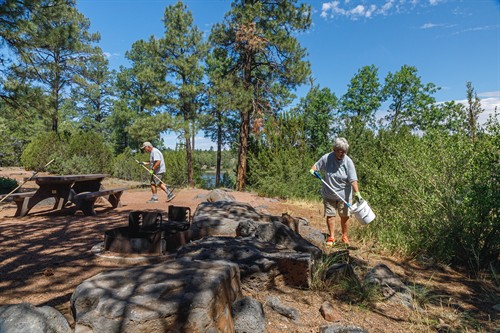 Volunteers cleaning a campsite