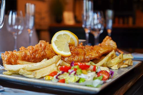 Crispy battered fish, proper pub style.