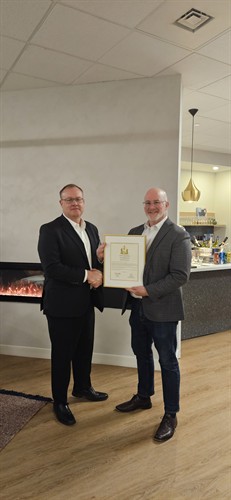 Sean Devine presenting Mike McCarthy with Letter of Commendation 