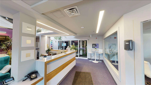 The lobby of our building is welcoming and warm. You'll be greeted by a staff member who will welcome you to the space. 