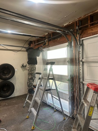 Fixing in Action - Garage Door Repair in Ottawa
