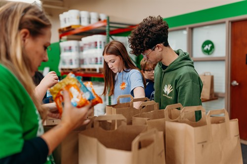 IMPACT helps VBSD families in need by providing groceries to students over extended breaks. School groups often help collect donations. 