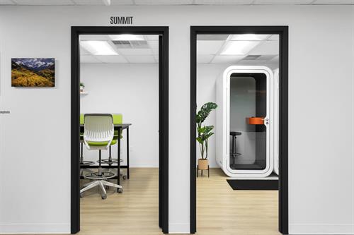 Summit meeting room on left. Solitude phone booth and printing room on the right.