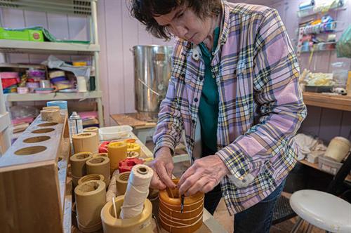 Mary working in Tinton Falls candle workshop