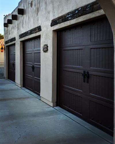 Simple yet Elegant Decorative Hardware Addition to a bead board style, wood grain color Garage Door.