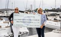 Freedom Boat Club Jacksonville presents a check to Captain Sandy Charities