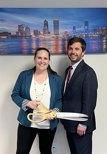 Attorneys Autumn and Sam celebrating new office 