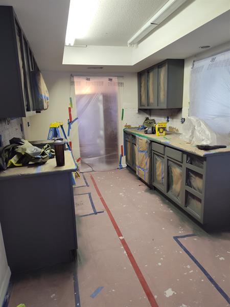 These cabinets were sanded and painted a beautiful dark gray color. 