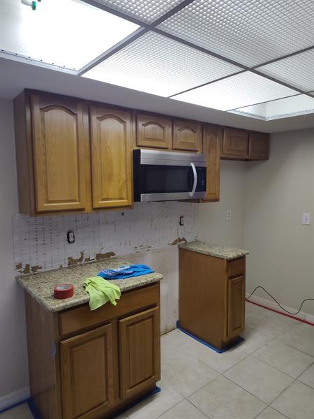 These cabinets were sanded and painted a beautiful dark gray color. 