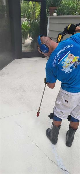 Here we are power washing, repairing and painting a pool deck.