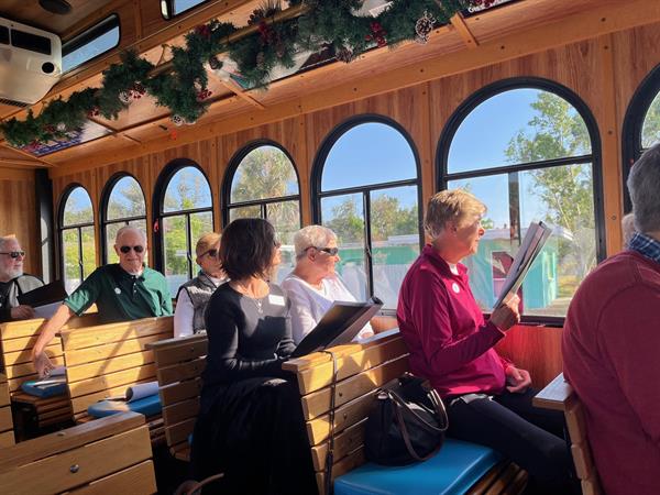 Guests enjoying looking at the photo booklet while they learn about Venice history