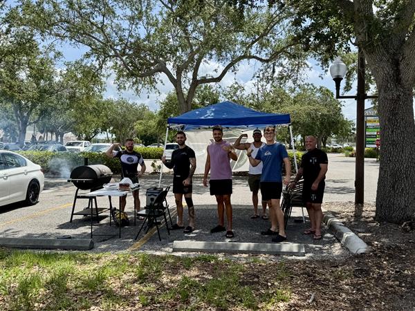 Community gathering- Coach Troy on the grill 
