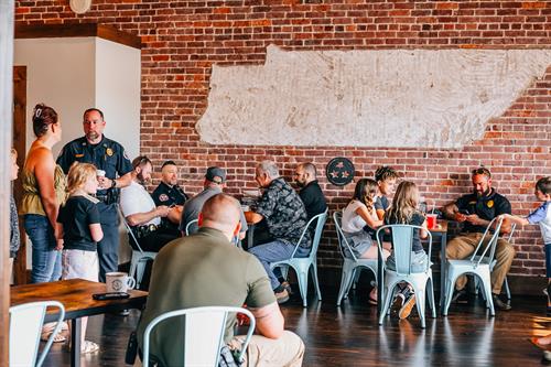 Haley Brazel Photography took photos of Coffee with a Portland Cop located at International Tea and Co.