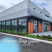 Modern business façade with hurricane-impact storefront glazing. Modern business façade with hurricane-impact storefront glazing.