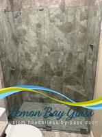 Custom frameless shower enclosure by Lemon Bay Glass — sleek, clear, and easy to maintain. Custom frameless shower enclosure by Lemon Bay Glass — sleek, clear, and easy to maintain.