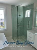 New Shower enclosure construction featuring precision-fit glass panels and brushed-nickel finishes. New Shower enclosure construction featuring precision-fit glass panels and brushed-nickel finishes.