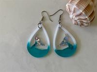 Glittery mermaid tail rising above the surface give these beachy earrings sparkle.