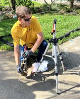 Stabilizing soil and lifting a Driveway back into place