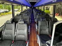 Gallery Image 56-passenger-charter-bus-rental-interior.jpg