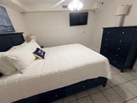 Gallery Image 2nd_bedroom_bed_and_TV.jpg