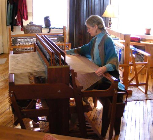 Weaving on a 4 harness jack loom at Artful Apparel