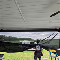 Vinyl & Shade Install Team, Installing screening 