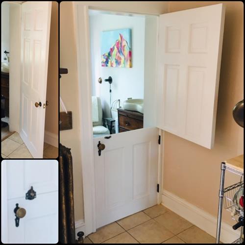 This Dutch door with owner-provided antique hardware keeps the dogs out of the kitchen without totally separating the 2 rooms..