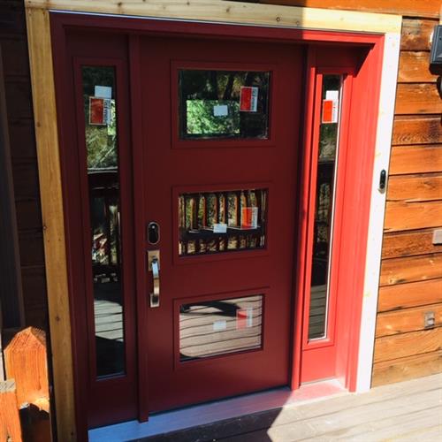 Red doors boost curb appeal & lots of windows bring in natural light
