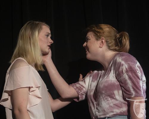 Actors Kiersten Cussins and Stefanie Townsend share a tender moment onstage for a performance of LOVE/SICK by John Cariani. Photo credits to Emily Piel