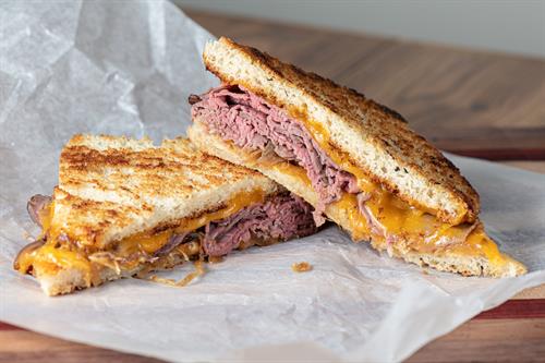The one and only Cowboy Sandwich... Sliced beef, smoked cheddar, horseradish mayo, and house caramelized onions.....