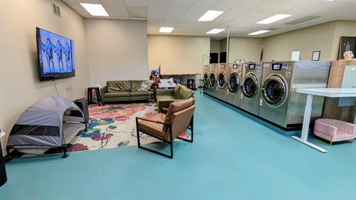 Livingroom area for families to sit while waiting for laundry.