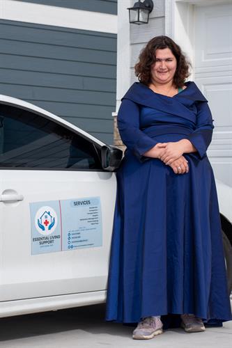 Essential Living Support representative by our branded vehicle, highlighting professional, veteran owned care in Cheyenne, WY.