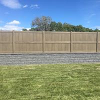 Dark Maple woodgrain vinyl fence